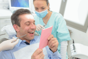 a patient and dentist chatting about dental crowns