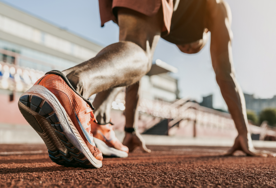 Marathon runner on track, getting ready to run