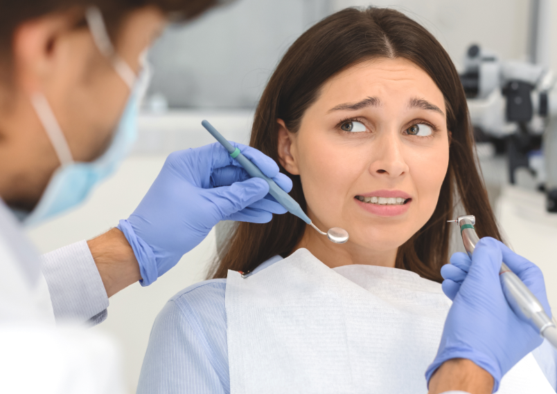 Woman looking nervous at dentist